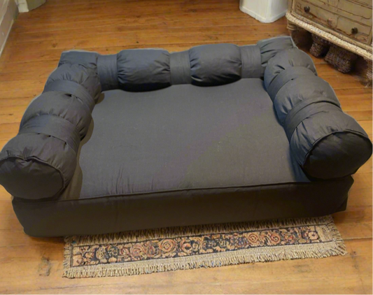 Large Eco Dog Couch with three bolster cushions featured in black